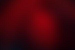 Crimson background with black shadows.