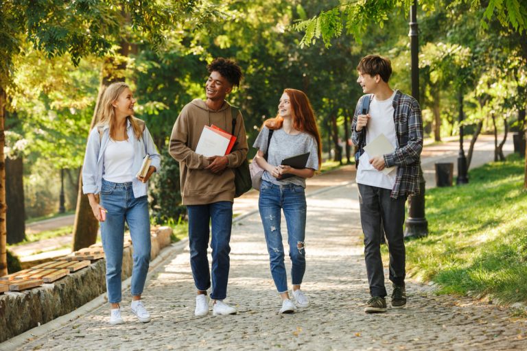 Group of students walking across campus